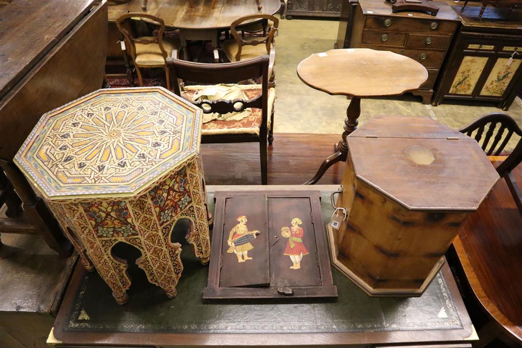 A Moroccan octagonal painted and decorated coffee table, an octagonal box with a hinged lid and an Indian two door wall panel